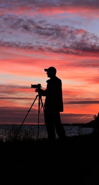 Photographer silhouette at sunset